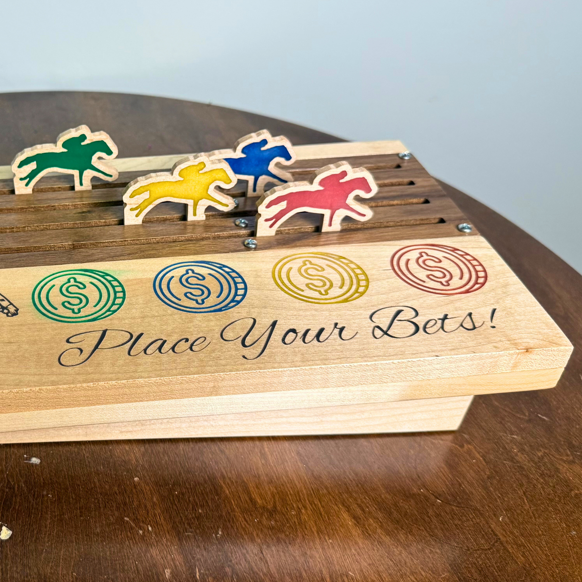 Wooden horse racing game with four colorful horses